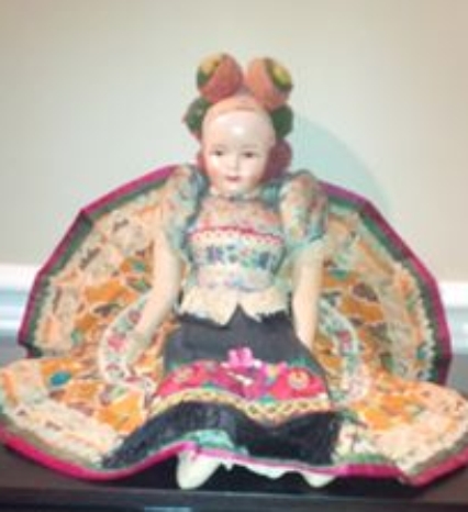 hungarian doll with embroidery and pom-pom hat